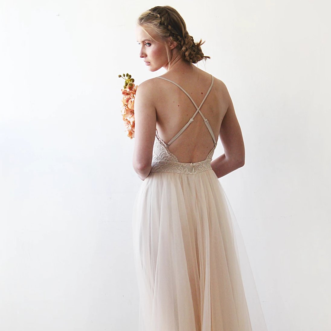 Three-quarter back view of the Champagne Lace and Tulle Wedding Dress showing the low open back and adjustable crossed straps.