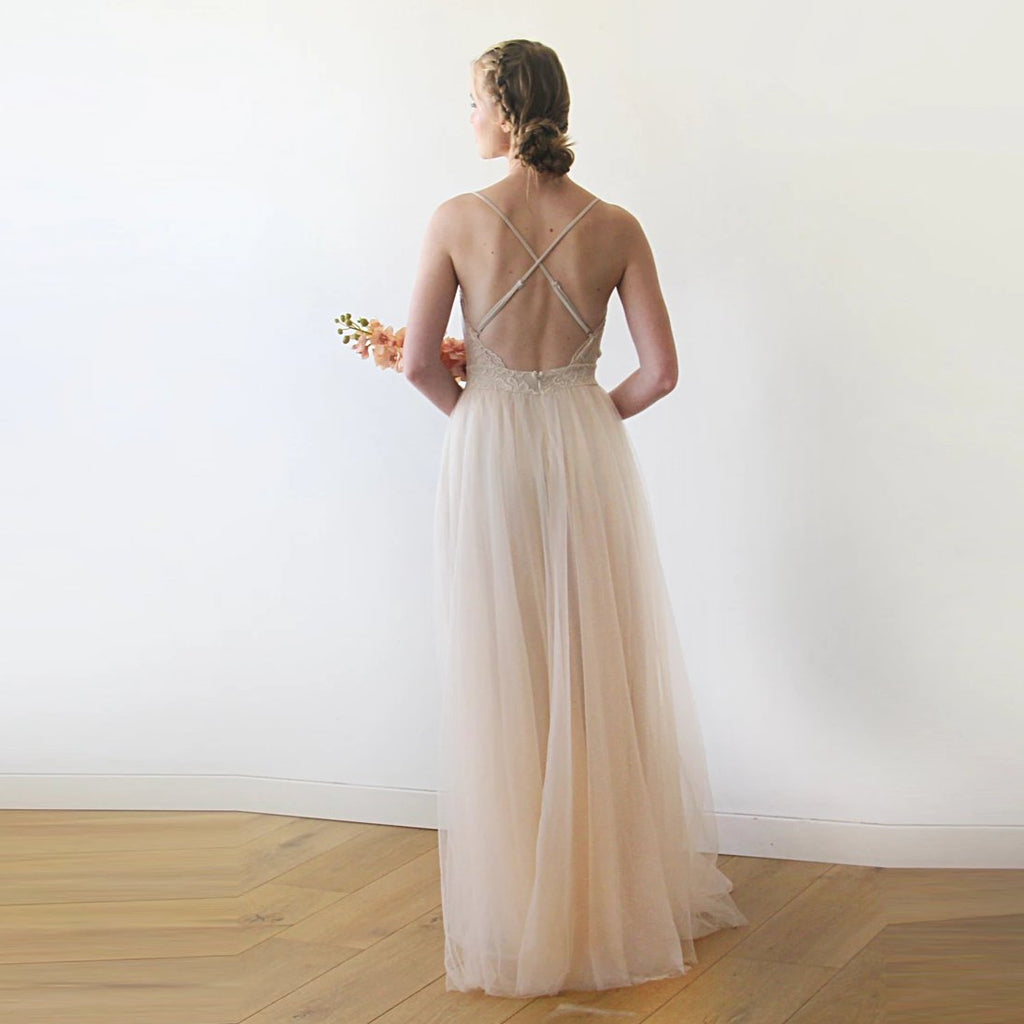 Full back view of the Champagne Lace and Tulle Wedding Dress 1205, showing the lower back, crossed straps and flowing tulle skirt.