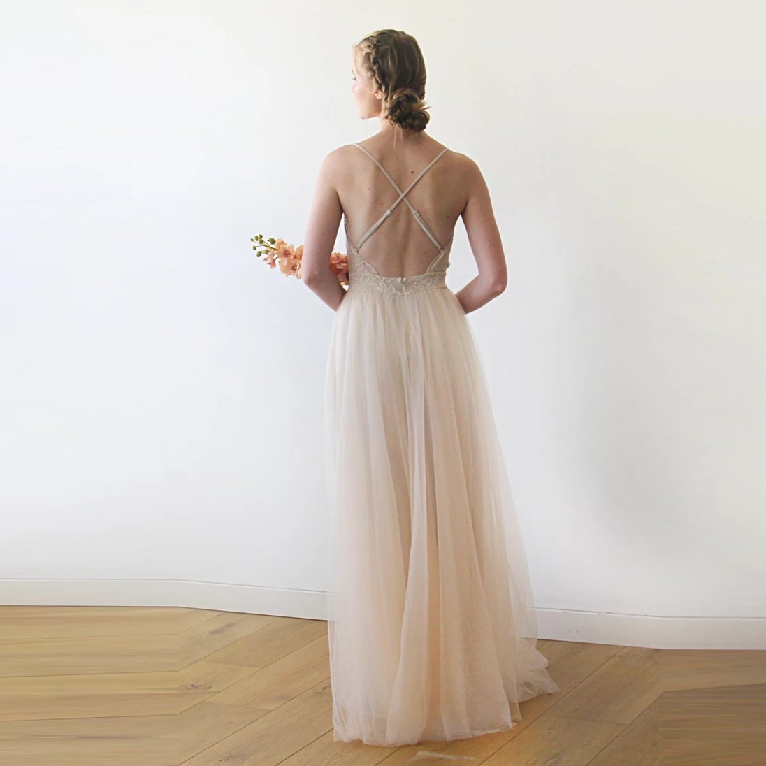 Full back view of the Champagne Lace and Tulle Wedding Dress 1205, showing the lower back, crossed straps and flowing tulle skirt.