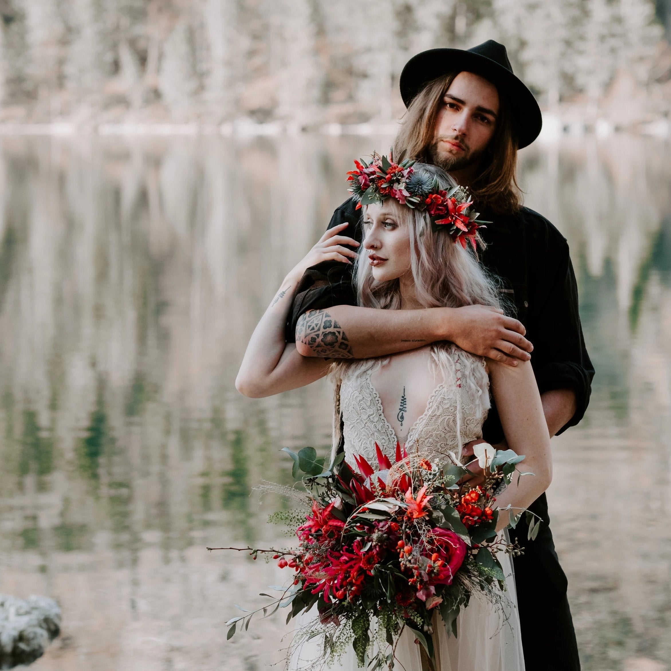 Bride wearing the Champagne Lace and Tulle Wedding Dress with her partner beside a mountain lake.